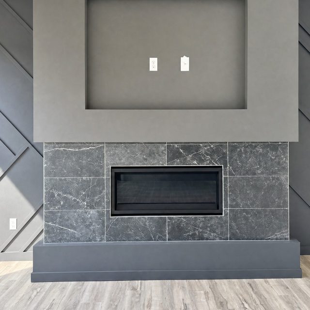 Charcoal marble-look porcelain wrapping a linear gas fireplace